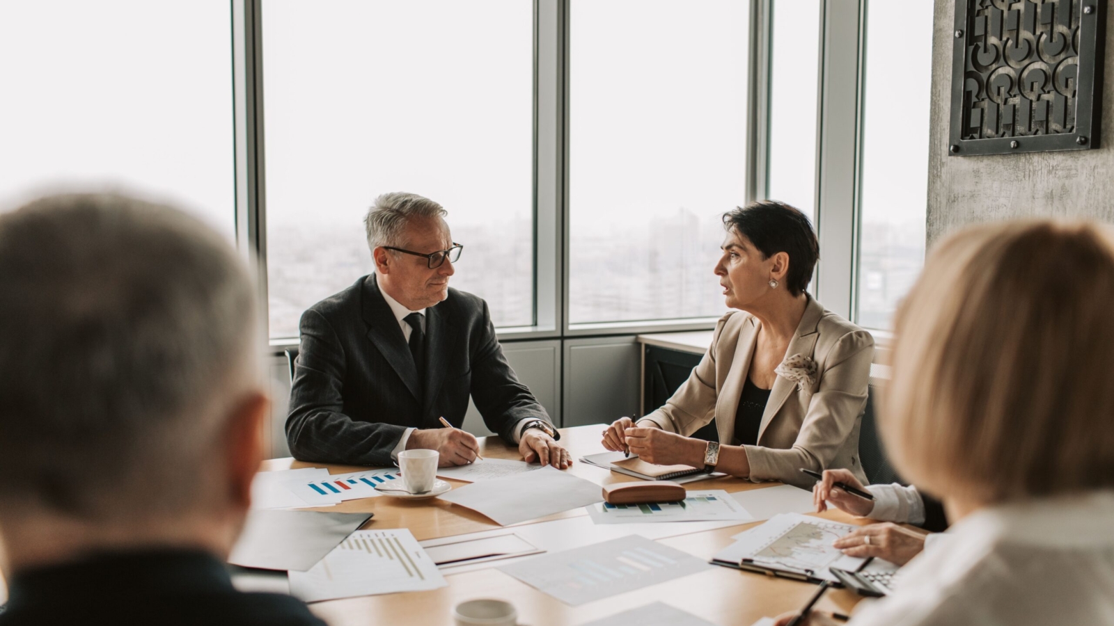 Business consultant reviewing paperwork with client